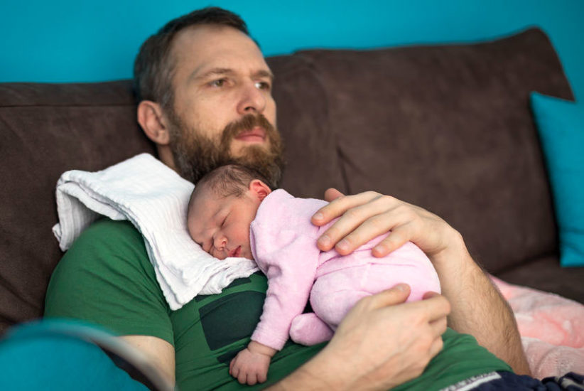 baby with reflux sleeps on his father