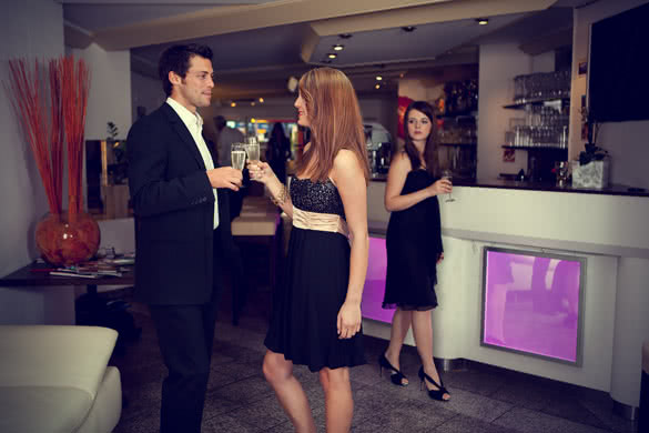 elegant man and woman drinking champagne