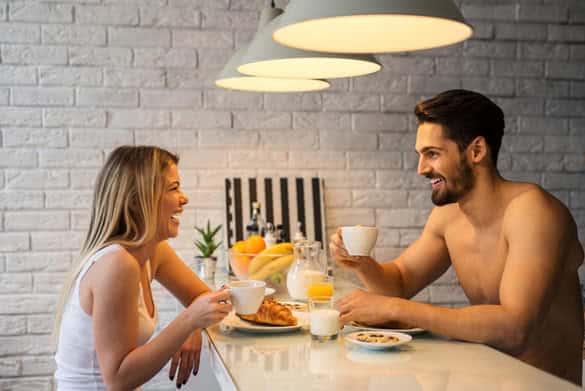 Couple enjoying morning coffee and breakfast together